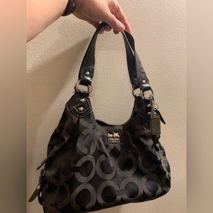 Coach Maggie Shoulder Bag. Black outside and purple inside. 3 sections. Used.